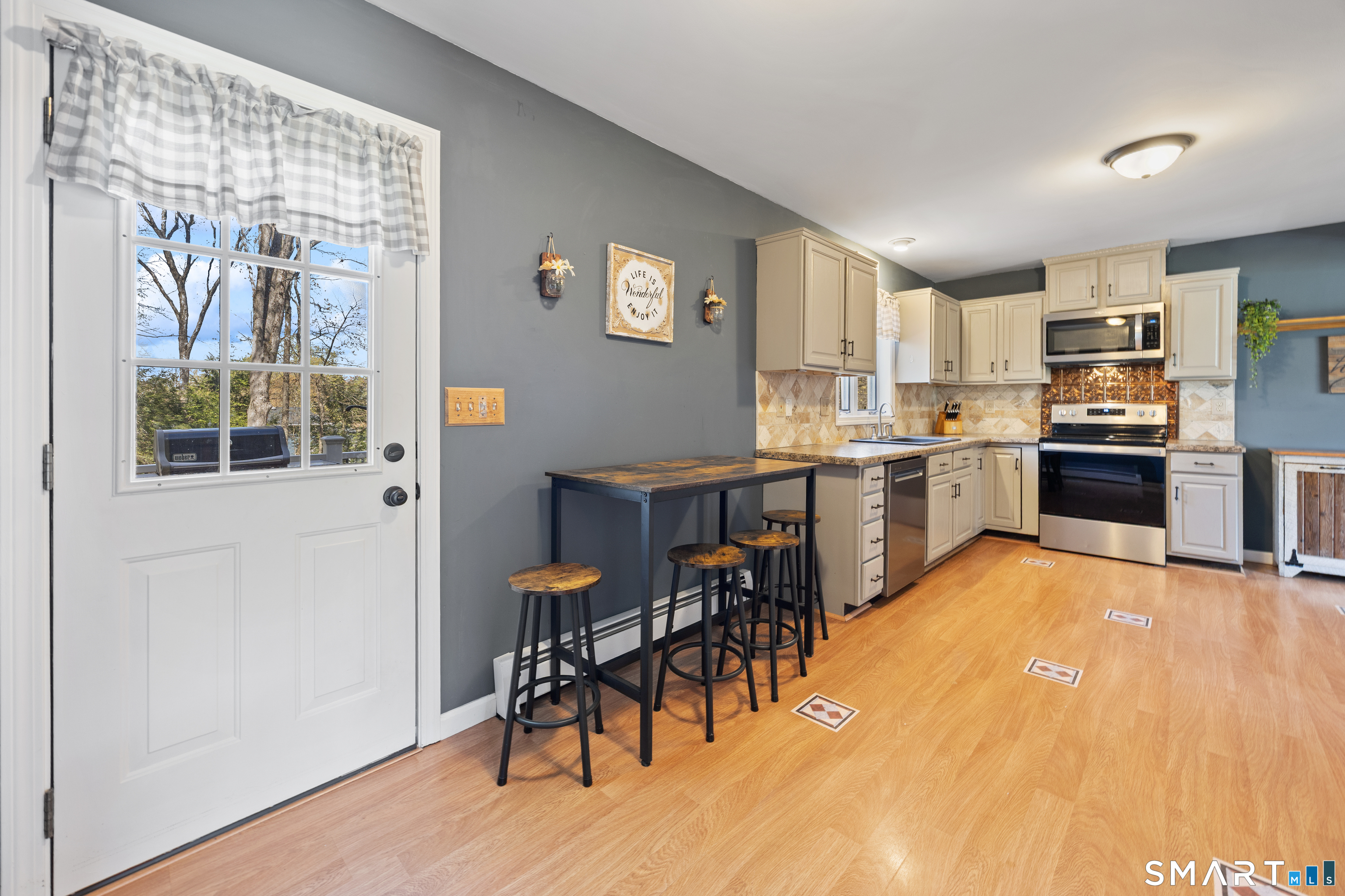 16 Stephen Court Prospect, CT 06712 - Photo 12 of 39 a view of a kitchen with furniture and wooden floor