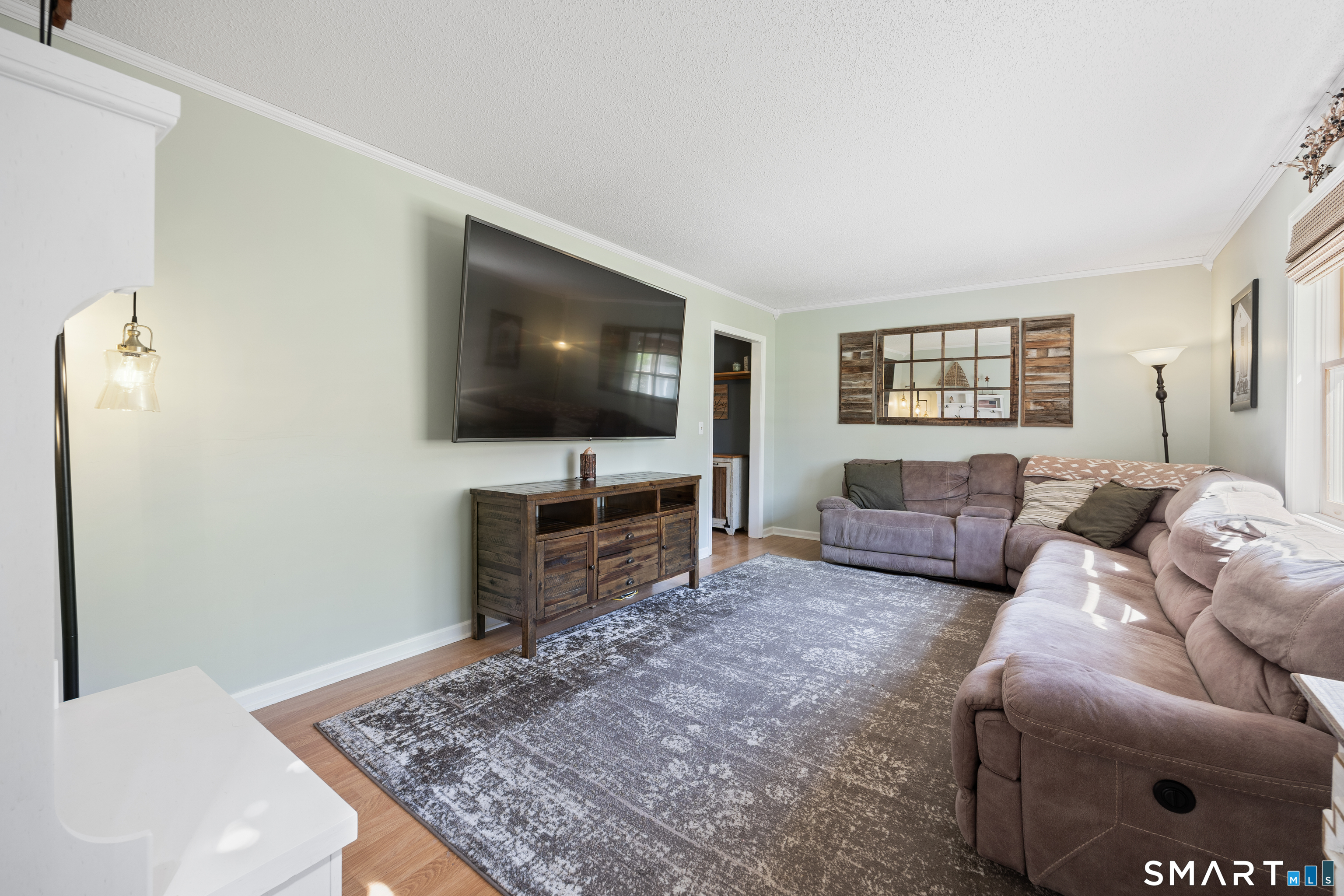 16 Stephen Court Prospect, CT 06712 - Photo 16 of 39 a living room with furniture and a flat screen tv