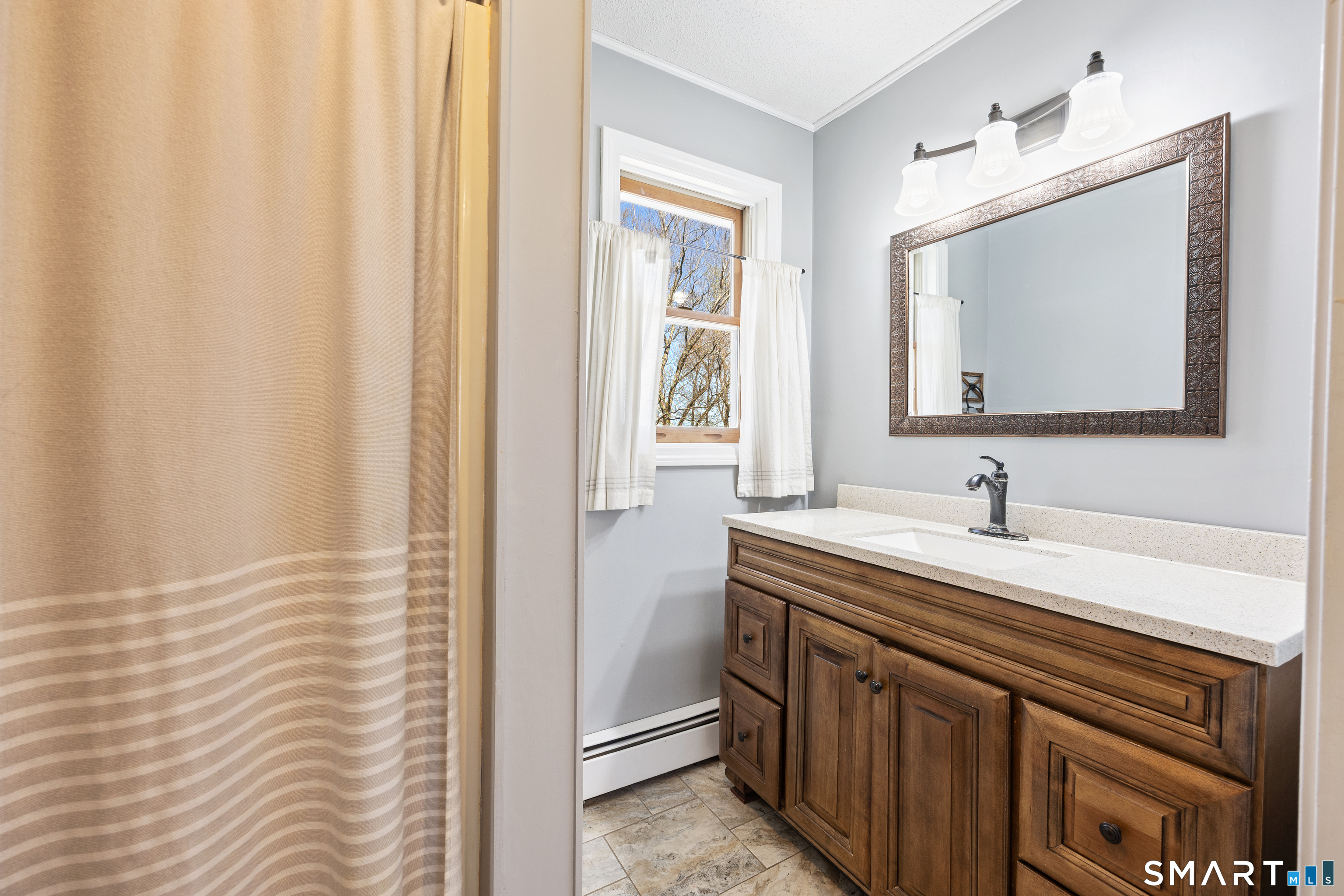 16 Stephen Court Prospect, CT 06712 - Photo 20 of 39 a bathroom with a sink and a mirror