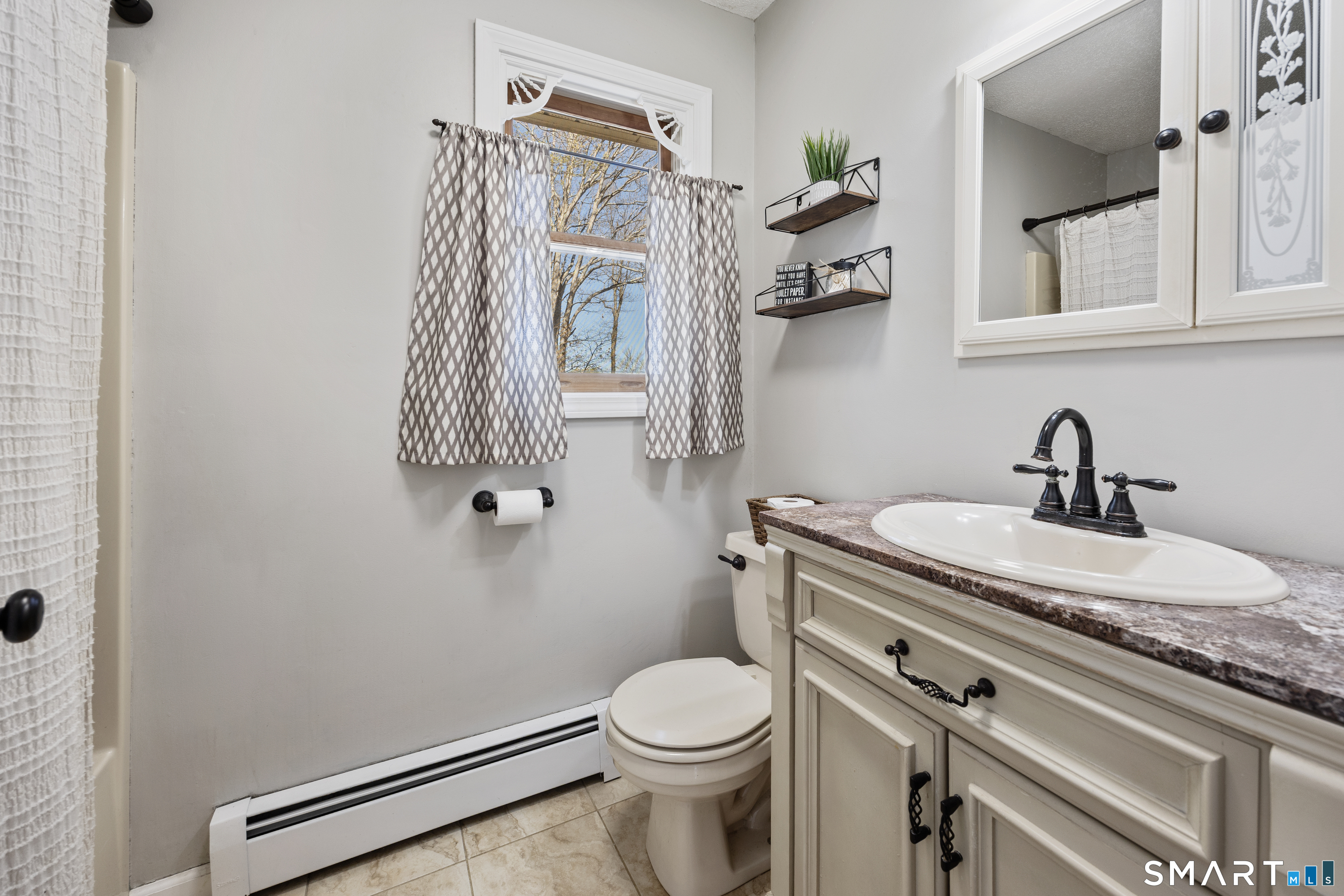 16 Stephen Court Prospect, CT 06712 - Photo 22 of 39 a bathroom with a granite countertop toilet sink and mirror