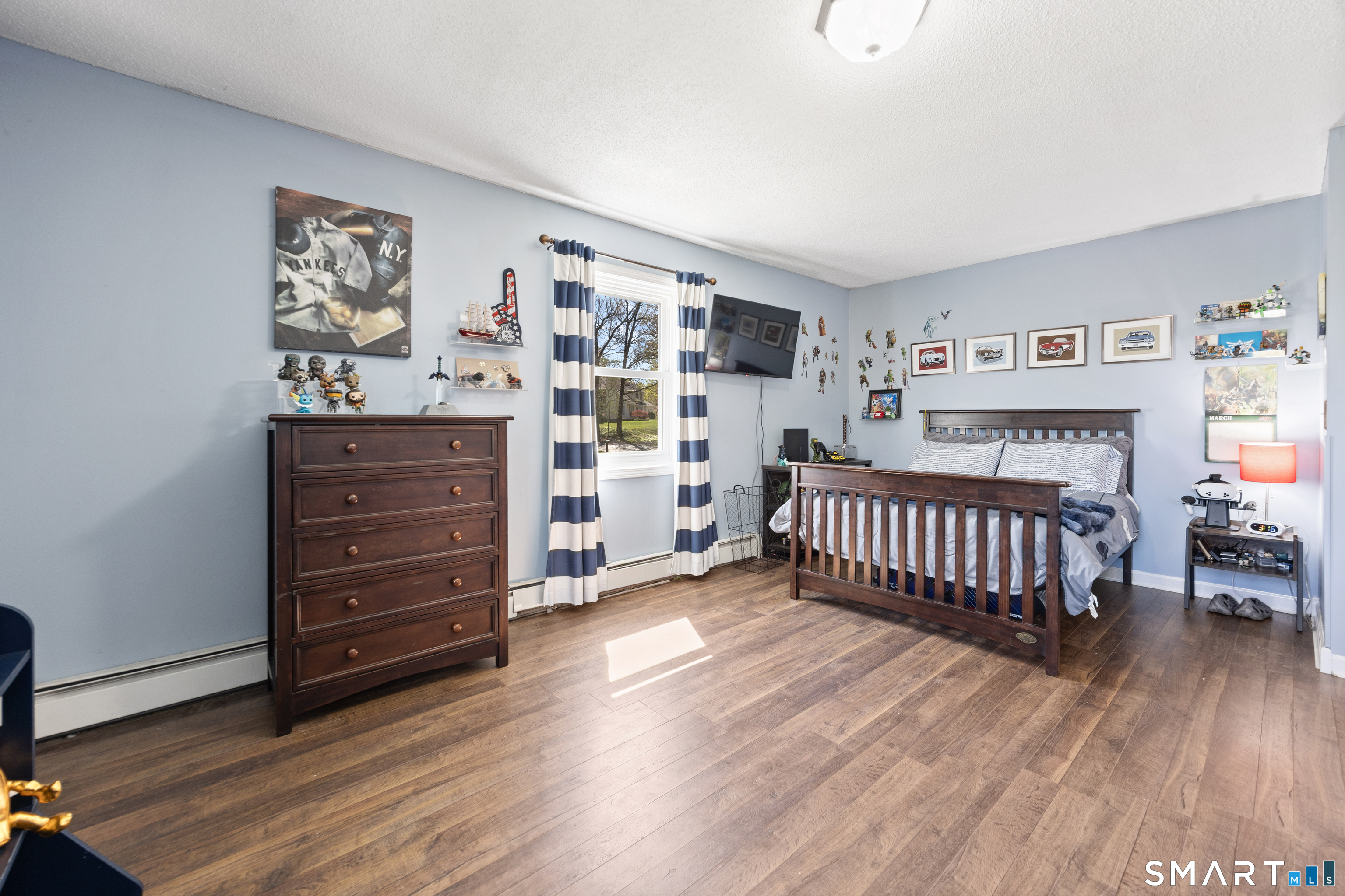 16 Stephen Court Prospect, CT 06712 - Photo 24 of 39 a bedroom with a bed and wooden floor