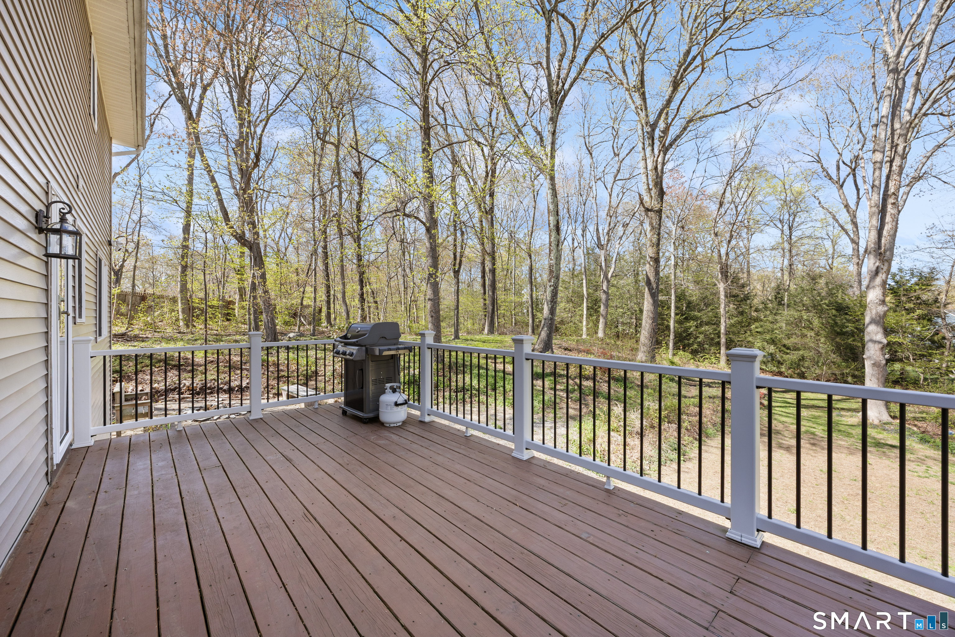 16 Stephen Court Prospect, CT 06712 - Photo 34 of 39 a view of a wooden deck with a large trees
