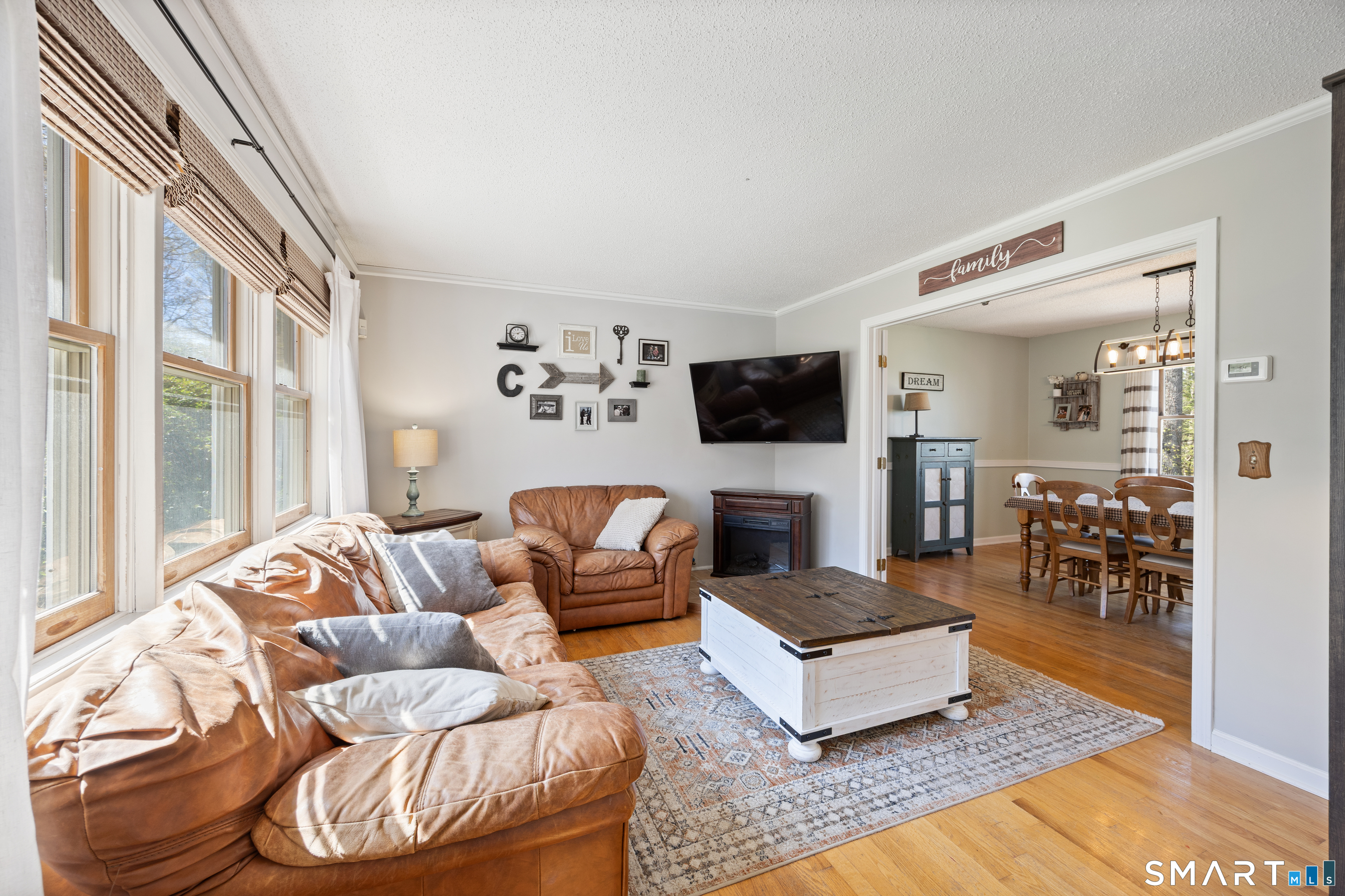 16 Stephen Court Prospect, CT 06712 - Photo 6 of 39 a living room with furniture and a flat screen tv