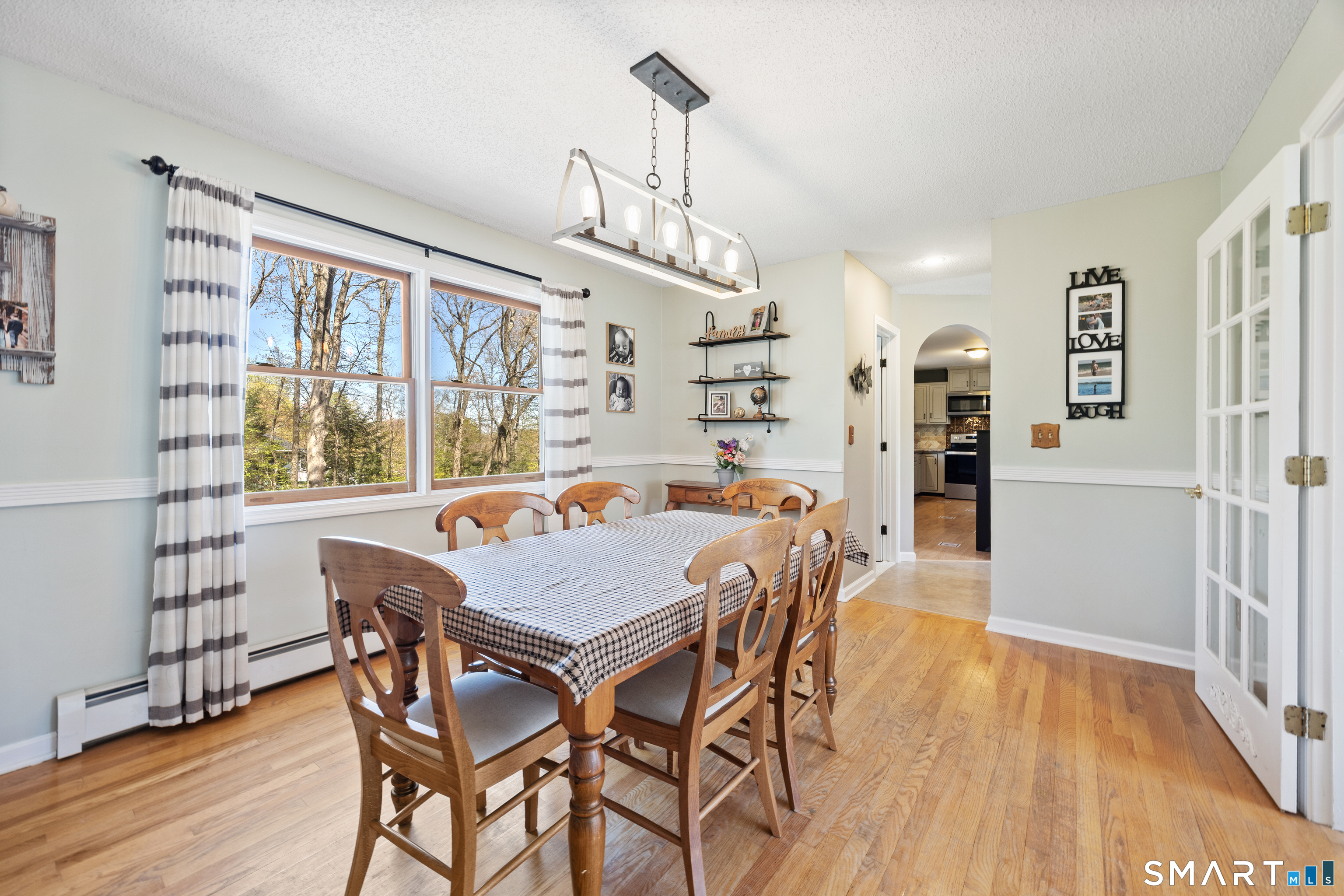 16 Stephen Court Prospect, CT 06712 - Photo 8 of 39 a view of a dining room with furniture window and wooden floor