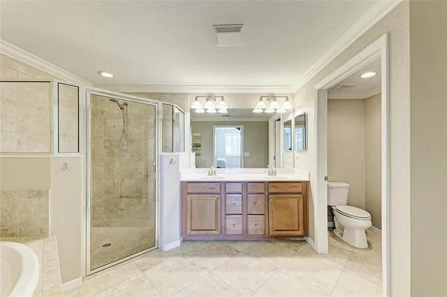 a view of a large building with an outdoor space and seating area