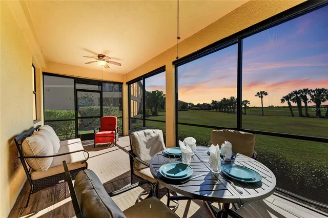 a front view of a house with a yard and palm trees