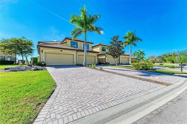 a view of a dining room with a table and chairs