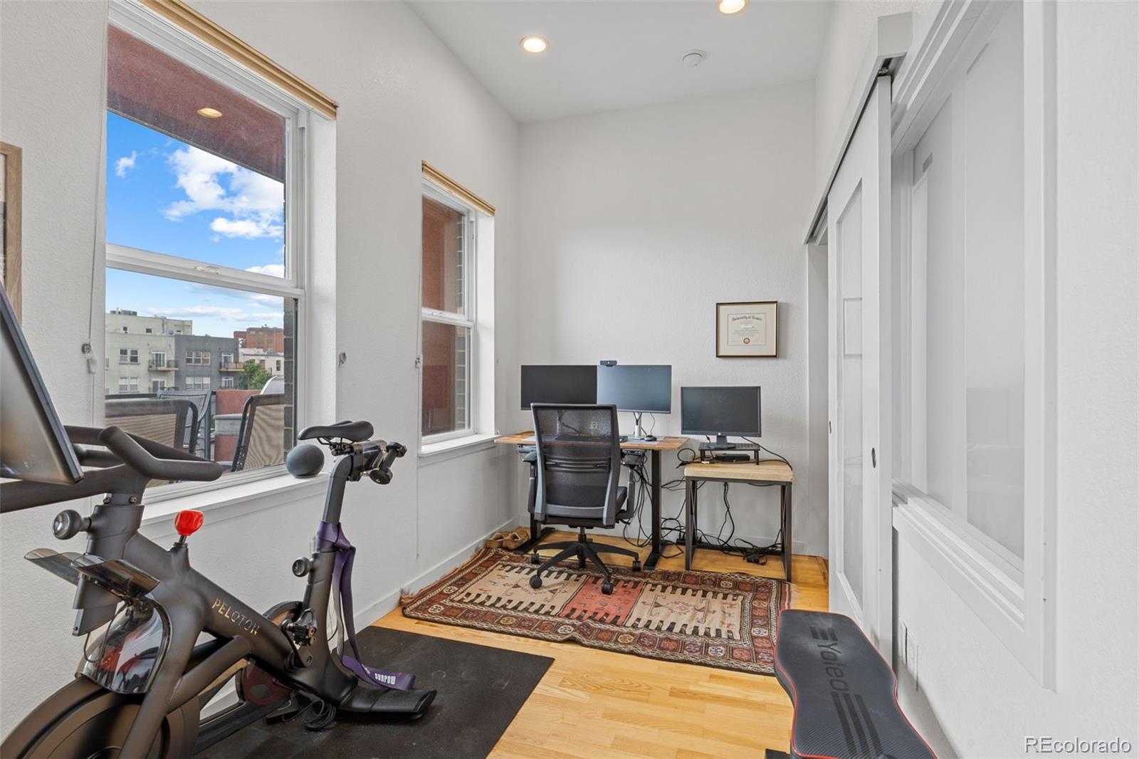 1555 Central Street, Unit 306 Denver, CO 80211 - Photo 15 of 36 a view of a workspace with furniture and a window
