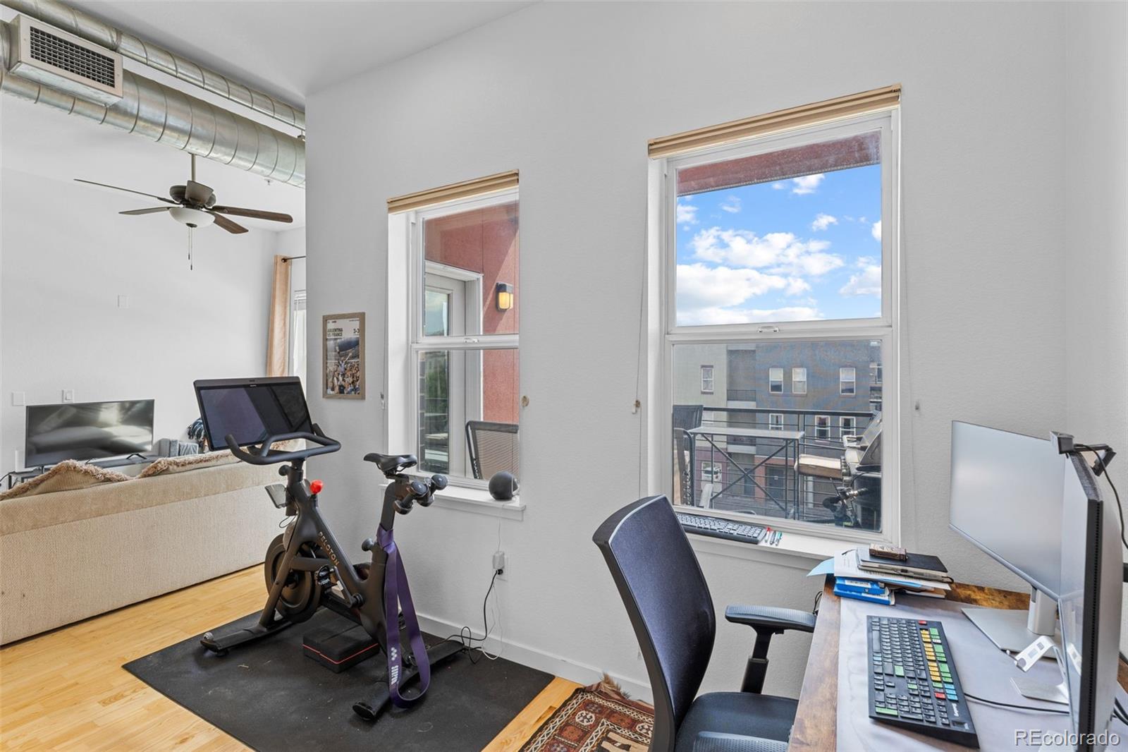 1555 Central Street, Unit 306 Denver, CO 80211 - Photo 16 of 36 a view of a workspace with furniture and a window