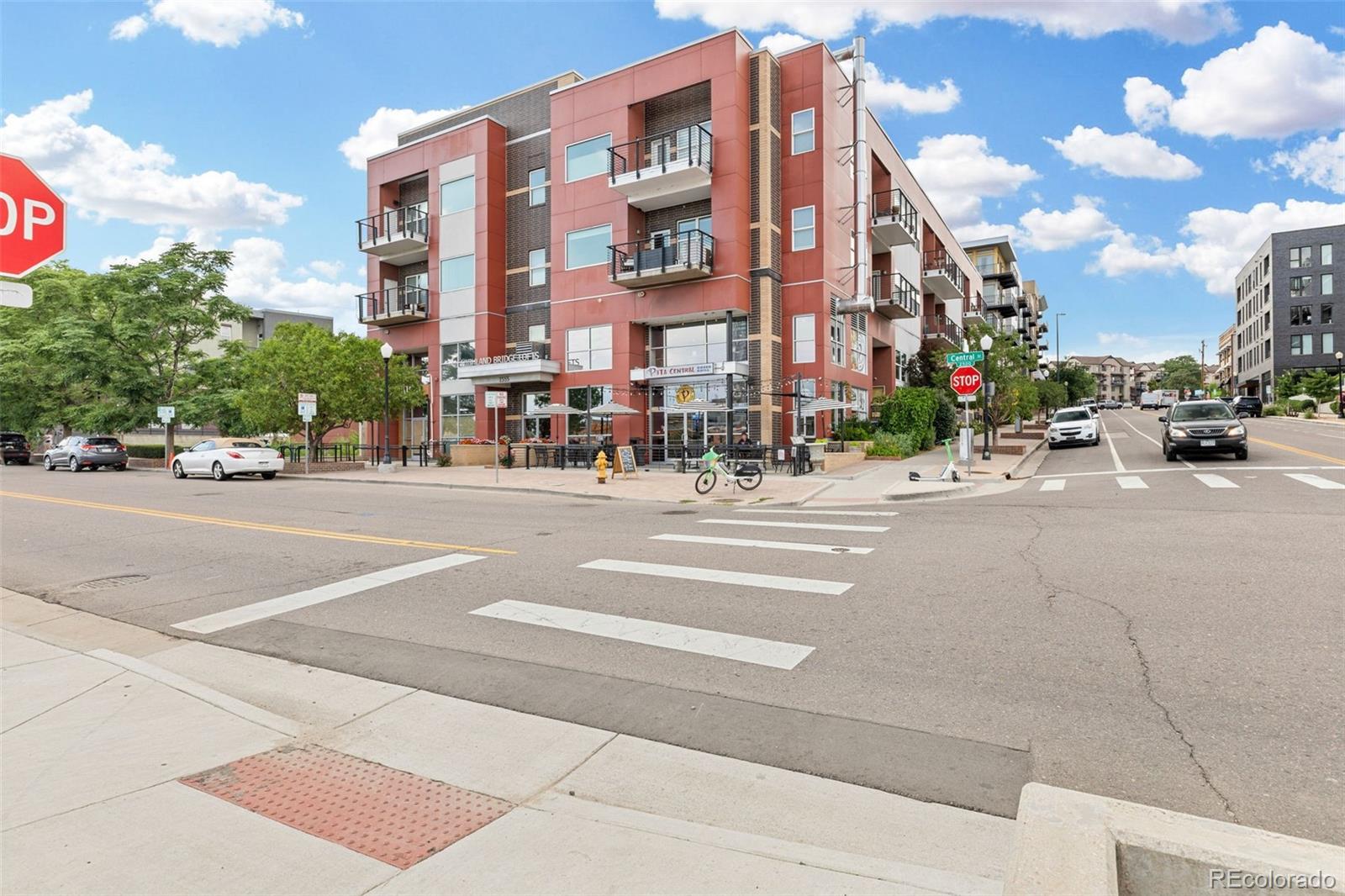 1555 Central Street, Unit 306 Denver, CO 80211 - Photo 2 of 36 a city street lined with buildings and a street view