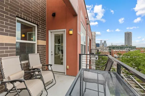 a view of a chairs and table in the terrace