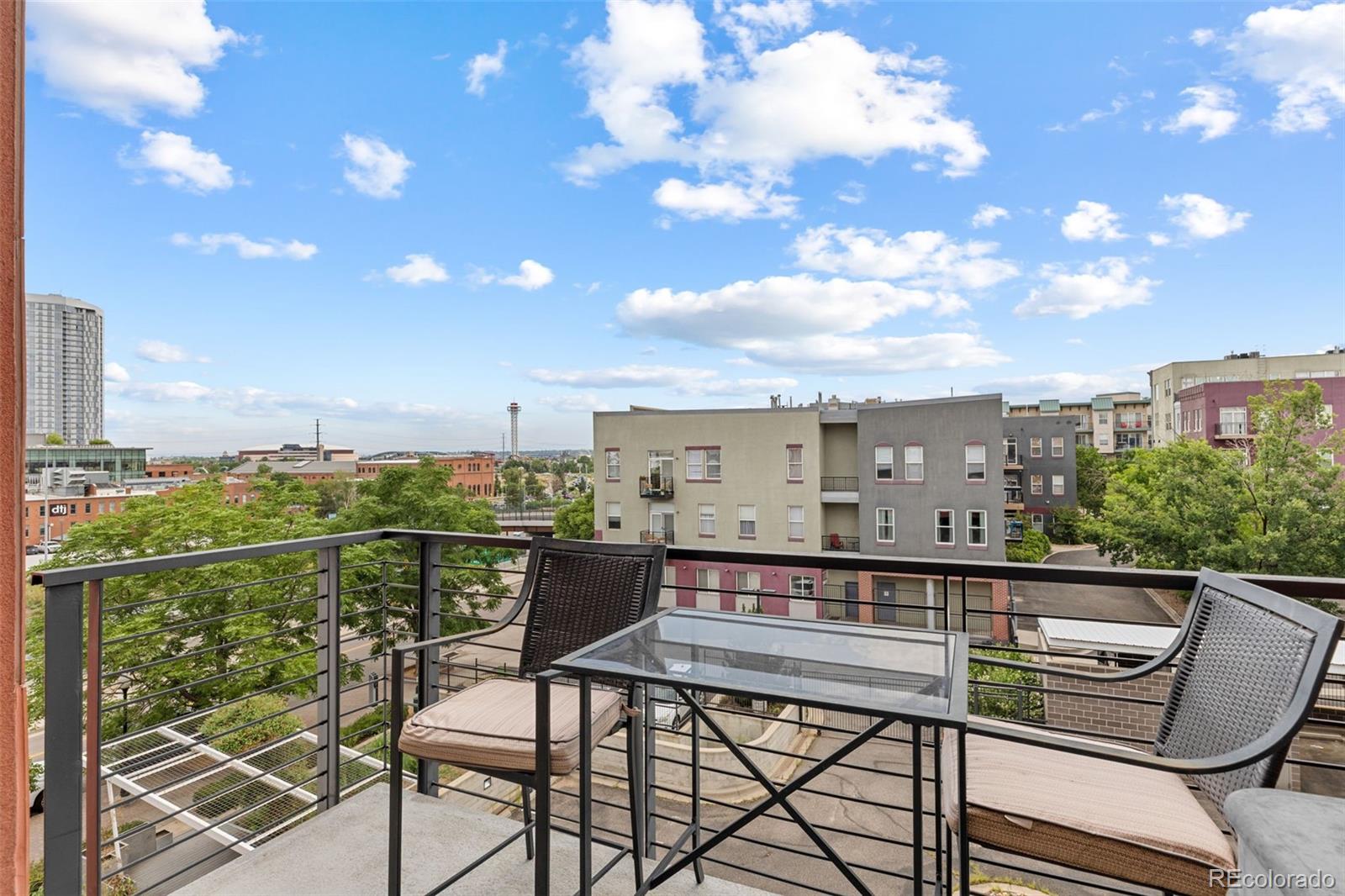1555 Central Street, Unit 306 Denver, CO 80211 - Photo 23 of 36 a view of a chairs and table in the terrace