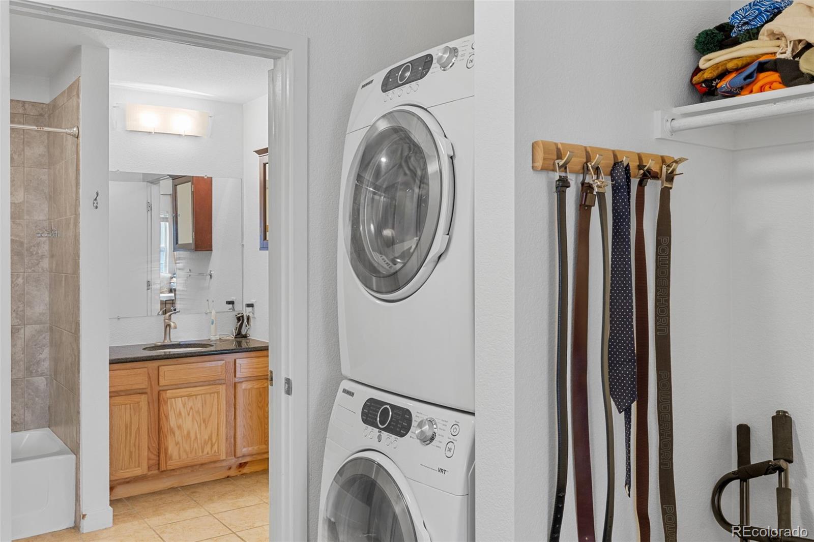 1555 Central Street, Unit 306 Denver, CO 80211 - Photo 30 of 36 a utility room with dryer and washer