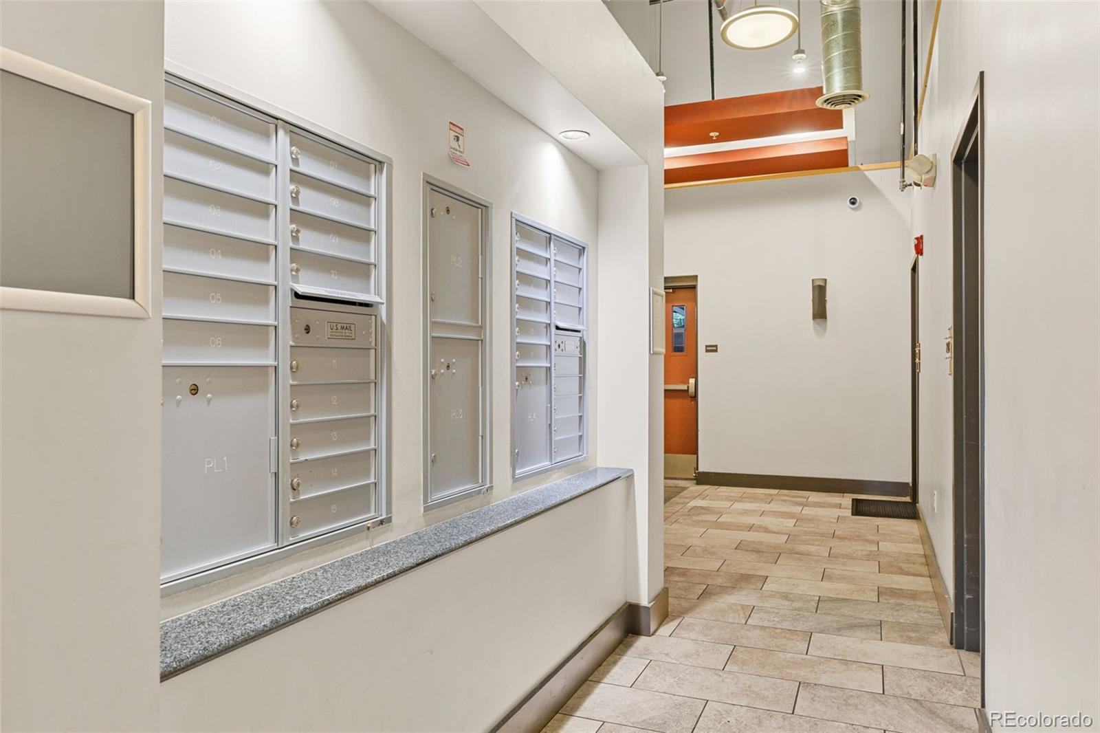 1555 Central Street, Unit 306 Denver, CO 80211 - Photo 31 of 36 a view of closet area with rug