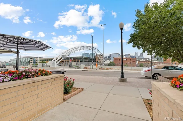 a view of a patio with table and chairs potted plants