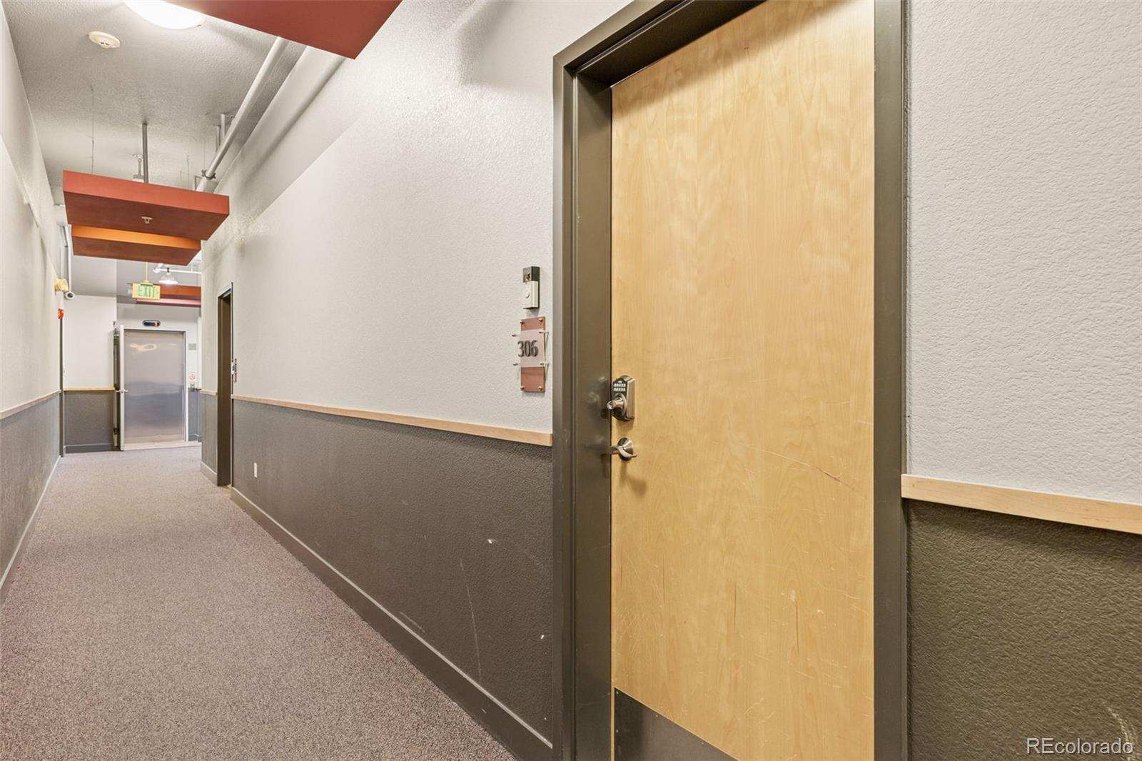 1555 Central Street, Unit 306 Denver, CO 80211 - Photo 7 of 36 a view of hallway with stairs