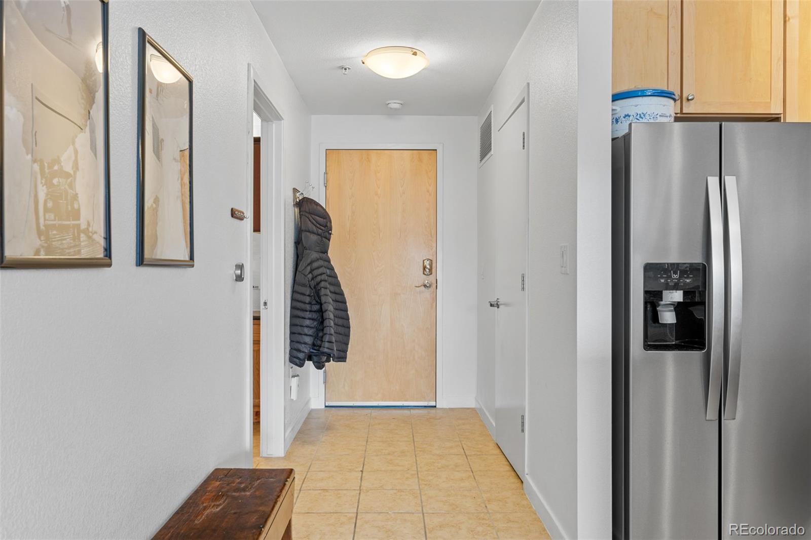 1555 Central Street, Unit 306 Denver, CO 80211 - Photo 8 of 36 a view of a hallway with walk in closet