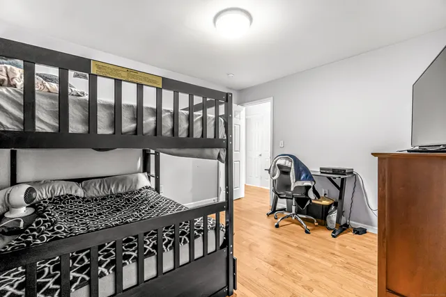 a bedroom with furniture and a window