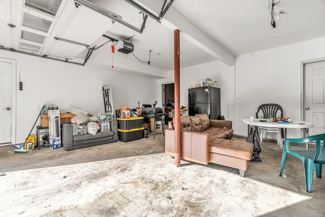 a view of a livingroom with furniture and a gym