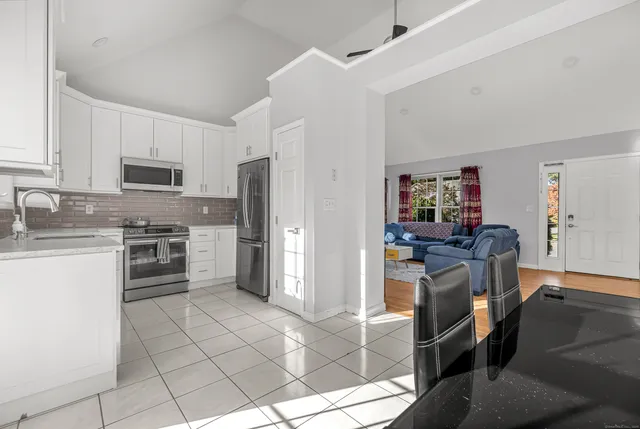 a kitchen with a stove a sink and a refrigerator