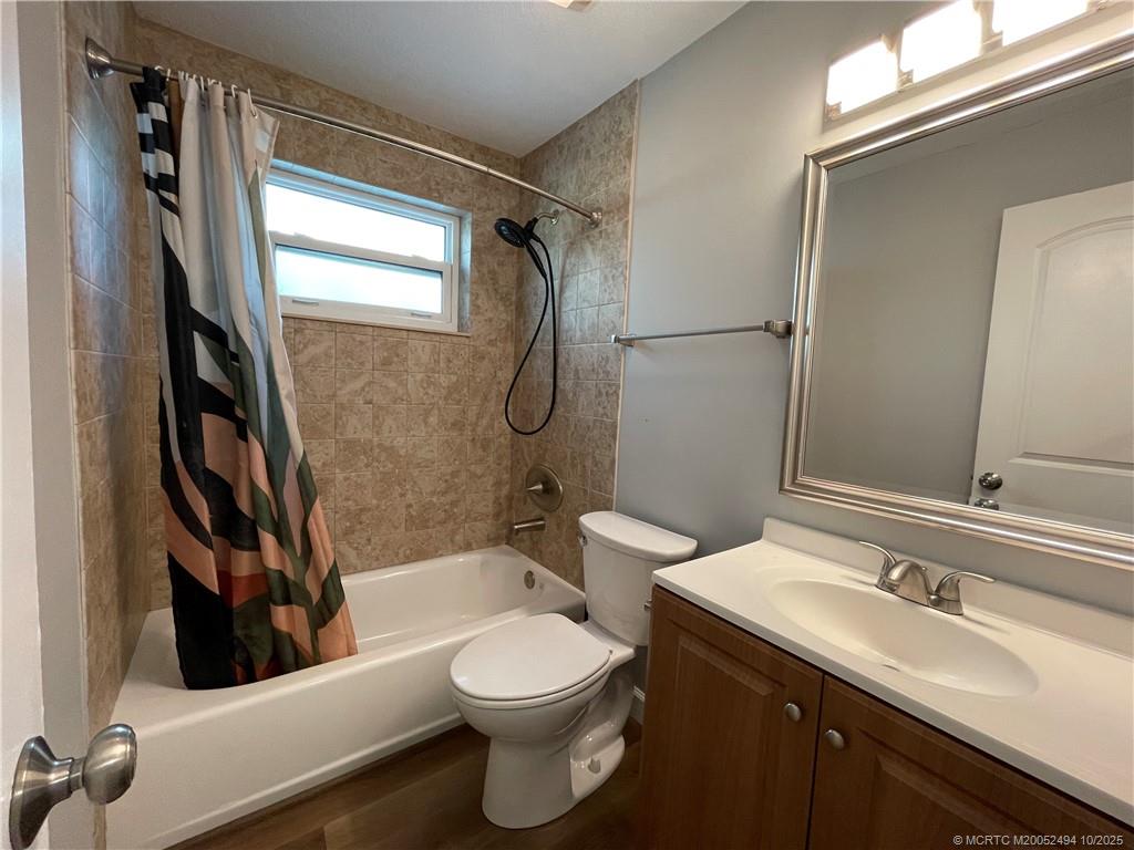 406 Robalo Court Stuart, FL 34996 - Photo 11 of 22 a bathroom with a sink a toilet and shower