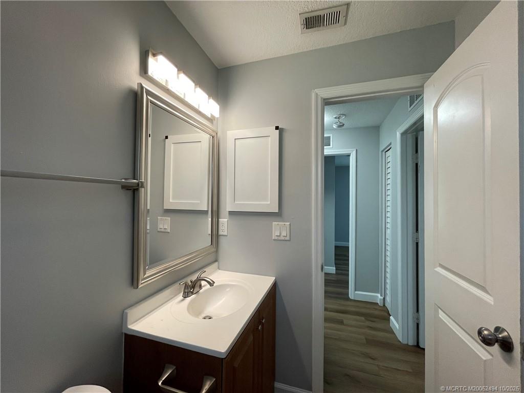 406 Robalo Court Stuart, FL 34996 - Photo 12 of 22 a bathroom with a sink and a mirror