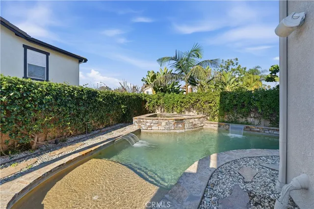 a view of a swimming pool with a yard