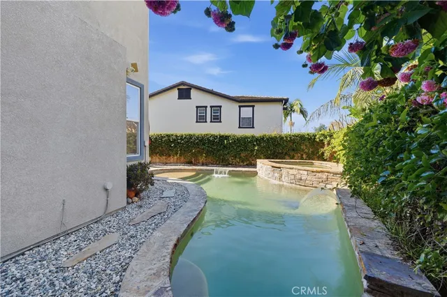 a view of a house with swimming pool