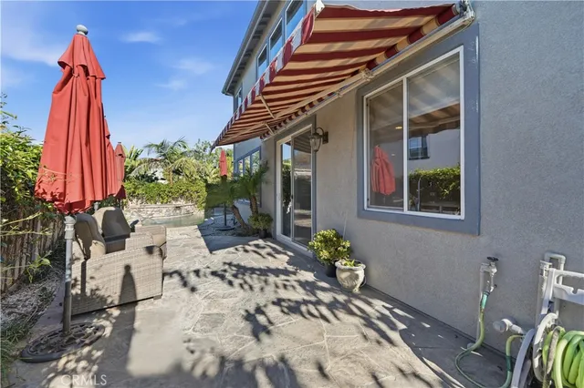 a view of backyard with a patio