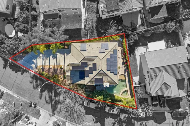 an aerial view of multiple houses with yard