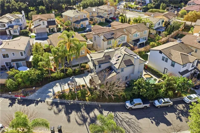 an aerial view of a house with a garden