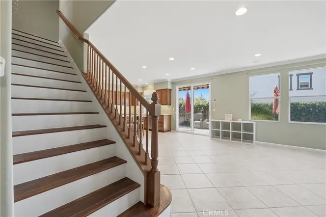 a view of staircase with white walls and windows