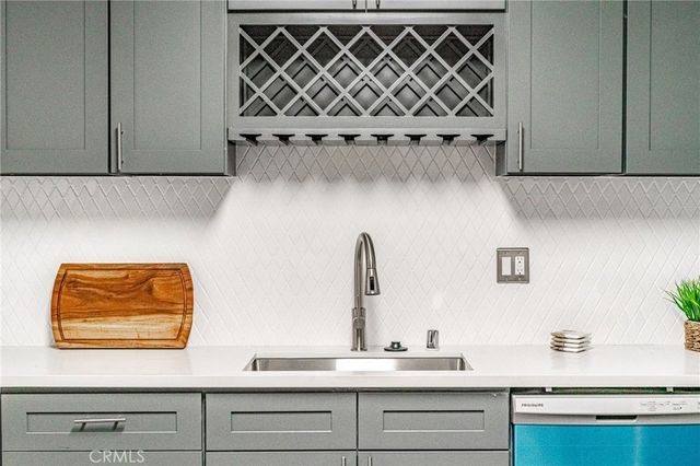 a bedroom with a bed and painting on the wall