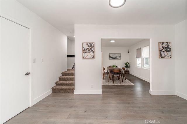 a kitchen with granite countertop wooden cabinets and stainless steel appliances