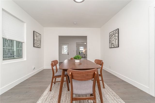 a bedroom with a bed and a table