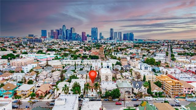 a living room with furniture rug and wooden floor