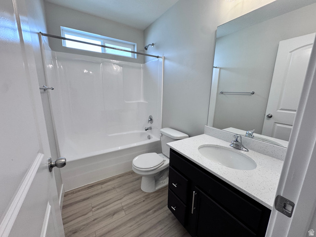 12339 Remy Road, Unit 422 Herriman, UT 84096 - Photo 9 of 36 Full bathroom featuring vanity, bathtub / shower combination, and light wood-type flooring