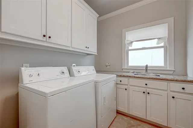 a utility room with closet dryer and washer