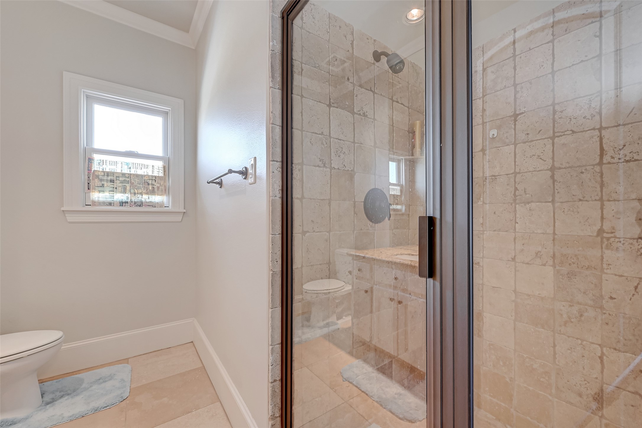 7619 Pine Ridge Terrace Road Houston, TX 77081 - Photo 15 of 32 a bathroom with a granite countertop shower and toilet
