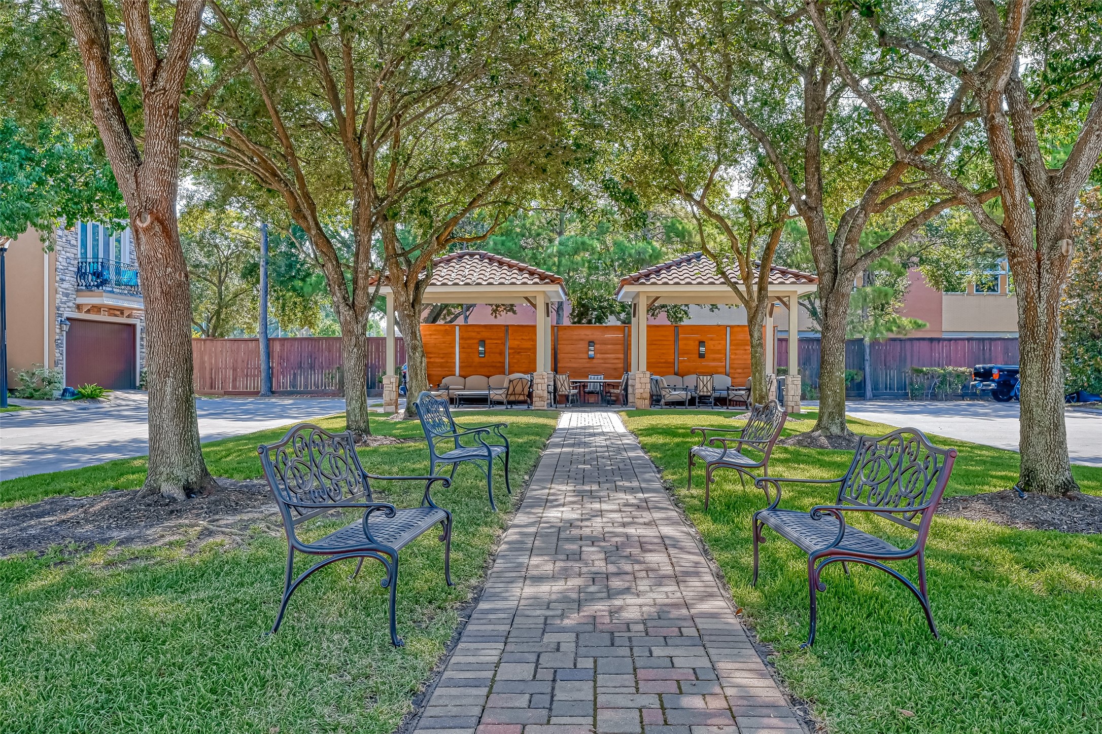 7619 Pine Ridge Terrace Road Houston, TX 77081 - Photo 29 of 32 a front view of a house with garden and sitting area