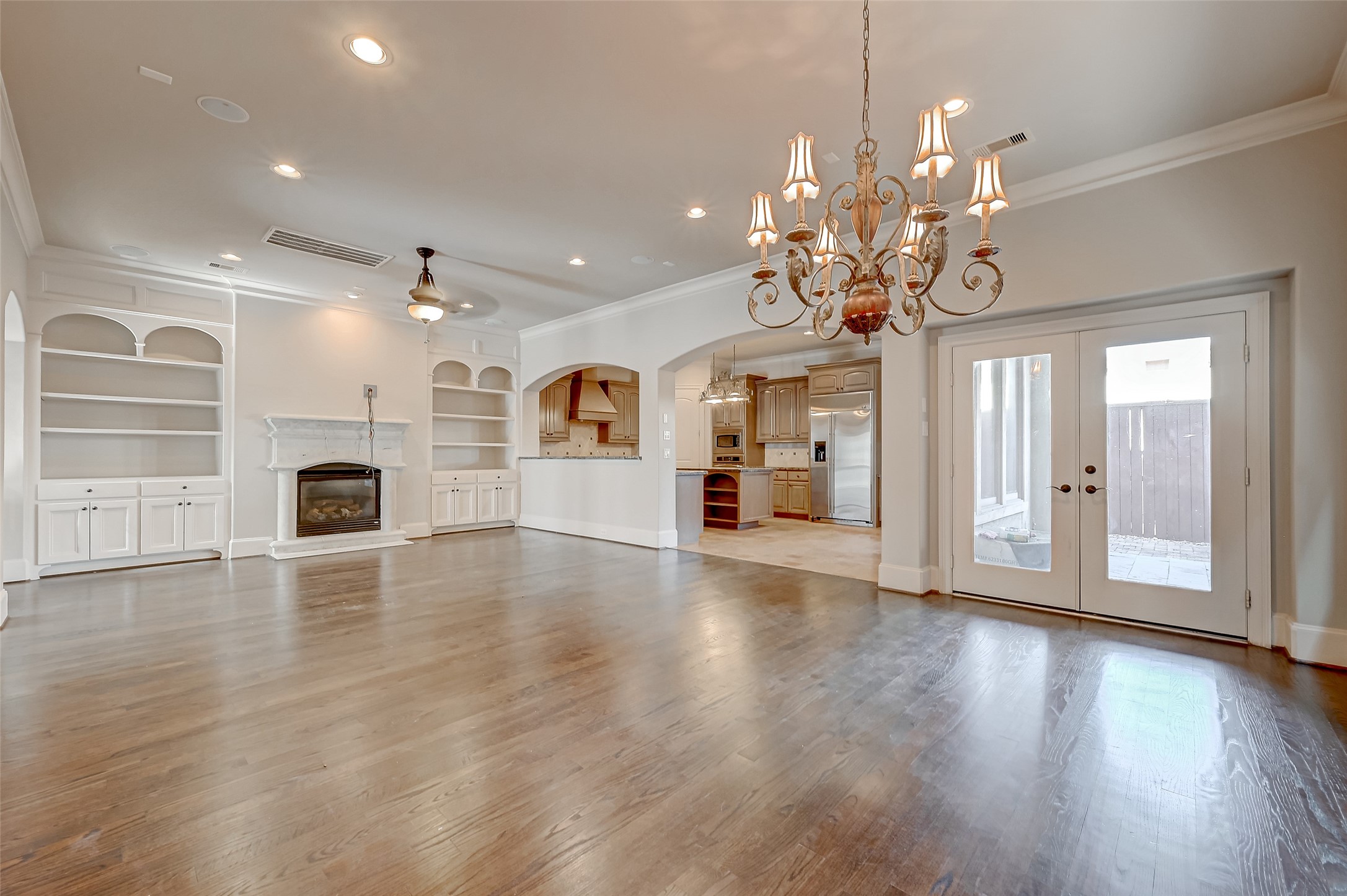 7619 Pine Ridge Terrace Road Houston, TX 77081 - Photo 6 of 32 a view of a big room with wooden floor fireplace and windows