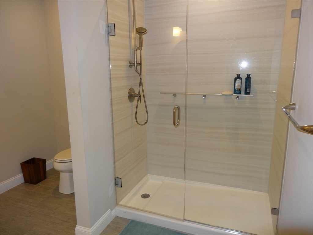 2 Inwood Drive, Unit 1005 Woburn, MA 01801 - Photo 8 of 8 a bathroom with a shower