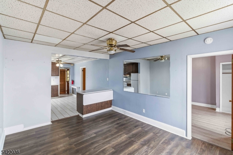 36 Edison Street Bloomfield, NJ 07003 - Photo 3 of 28 a view of a hallway with wooden floor and cabinet