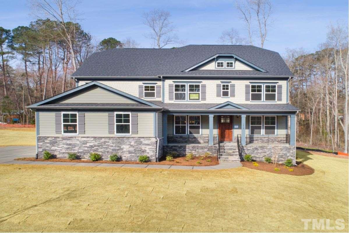 Fiber cement siding, architectural 30 year shingles, gorgeous front porch.