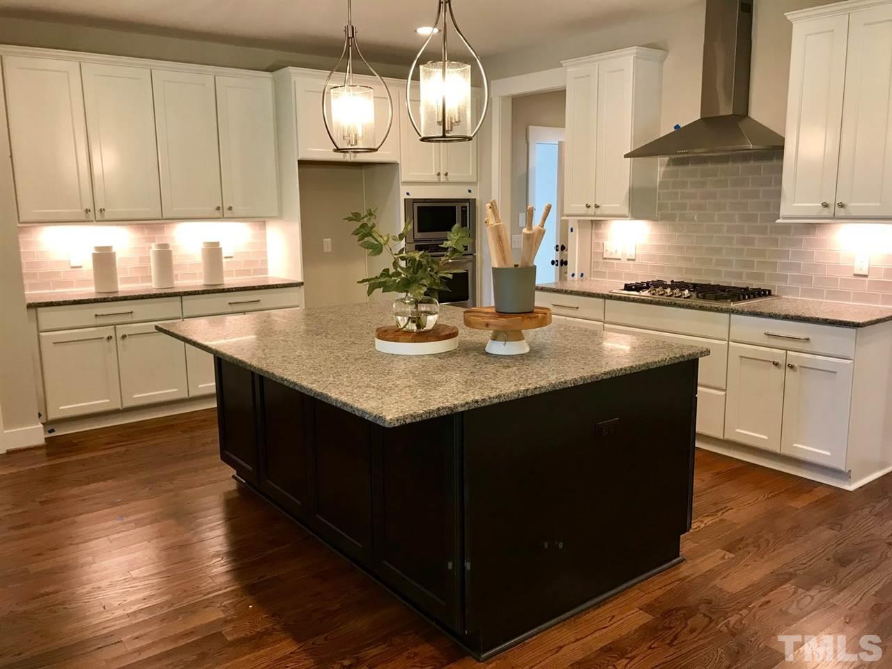 1416 Baileys Run Court Raleigh, NC 27606 - Photo 8 of 21 Just look at the size of this island. Plenty of holiday baking room.