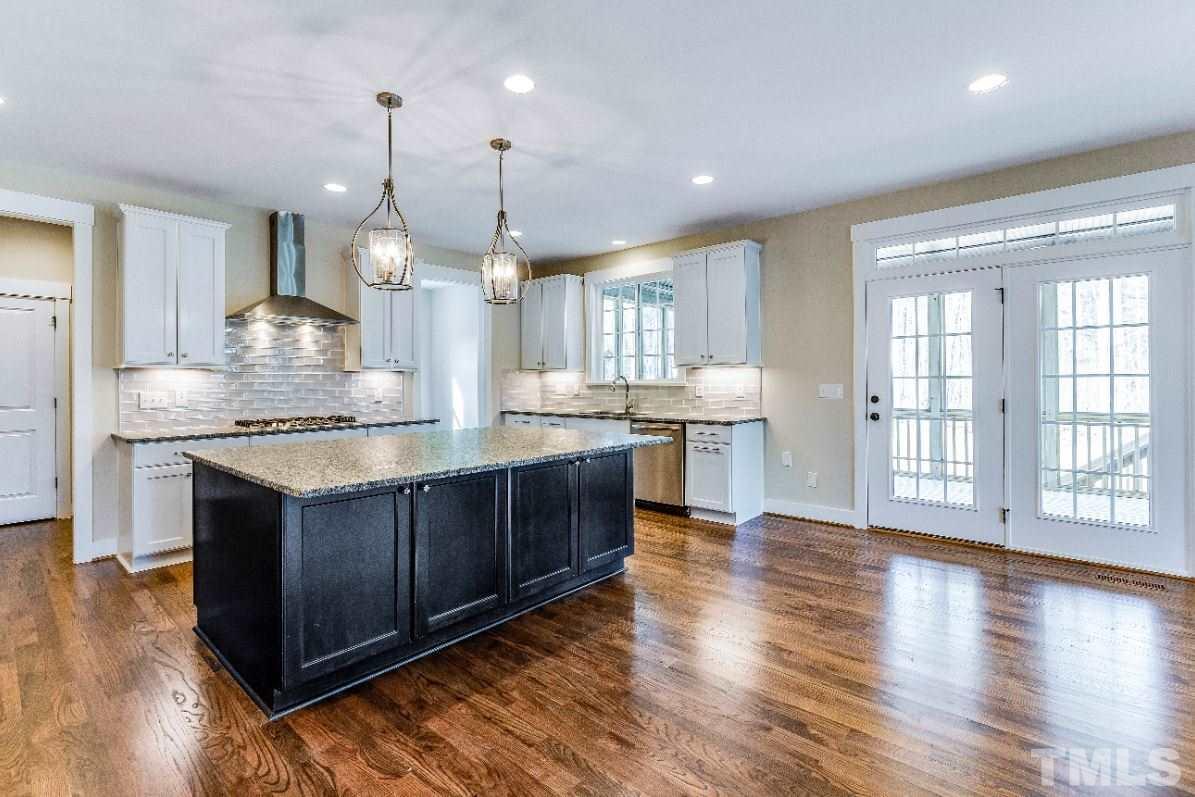 1416 Baileys Run Court Raleigh, NC 27606 - Photo 9 of 21 Table removed so you can see the gorgeous custom hardwood floors.