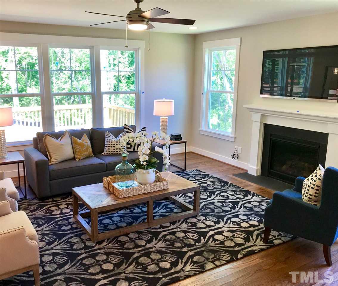 1416 Baileys Run Court Raleigh, NC 27606 - Photo 10 of 21 Gas fireplace, custom hardwood floors, fully cased windows.