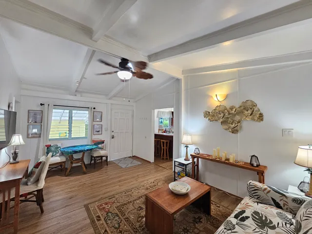 a kitchen with a sink a stove cabinets and window