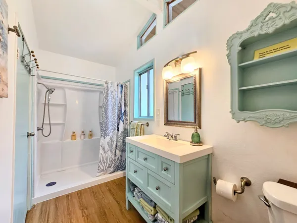 a view of balcony with furniture and wooden floor