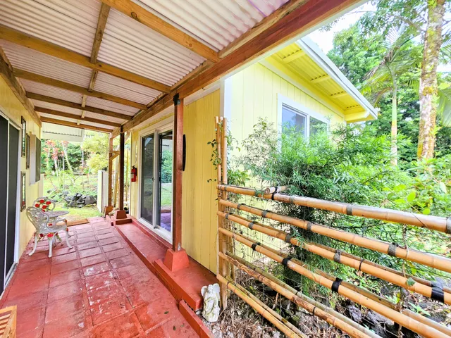 a bedroom with a bed window and table